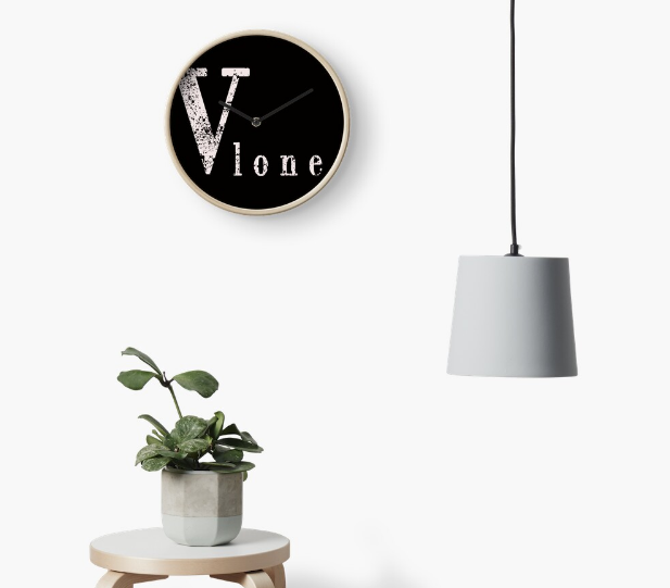 Vlone Sticker Clock, a modern artistic clock with Vlone sticker design, enhancing interior decor.